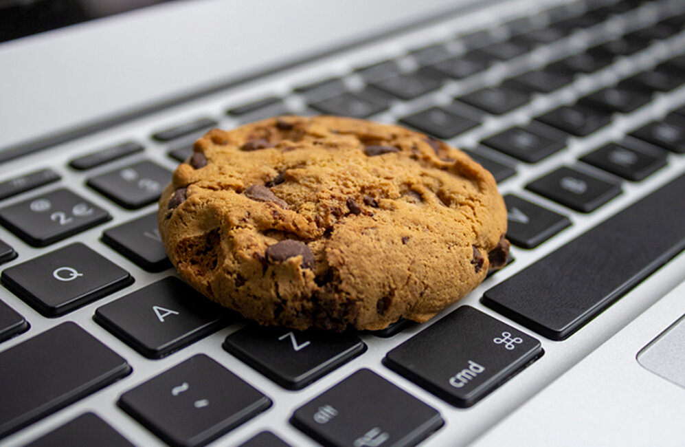 Chocolate Chip cookie on laptop keyboard