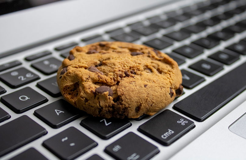 Chocolate Chip cookie on laptop keyboard